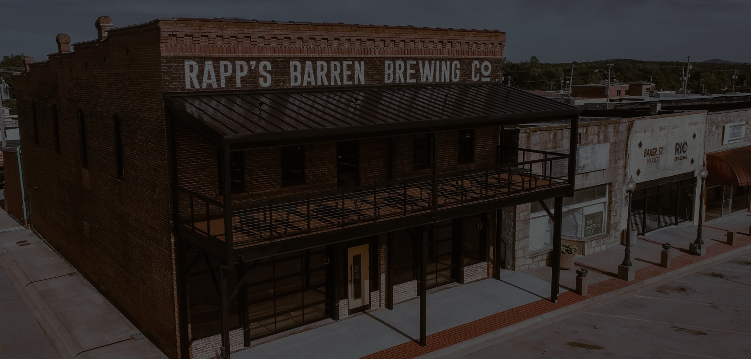 An aerial view of Rapp's Barren Brewing company in Mountain Home Arkansas offers, darkened for the website header page