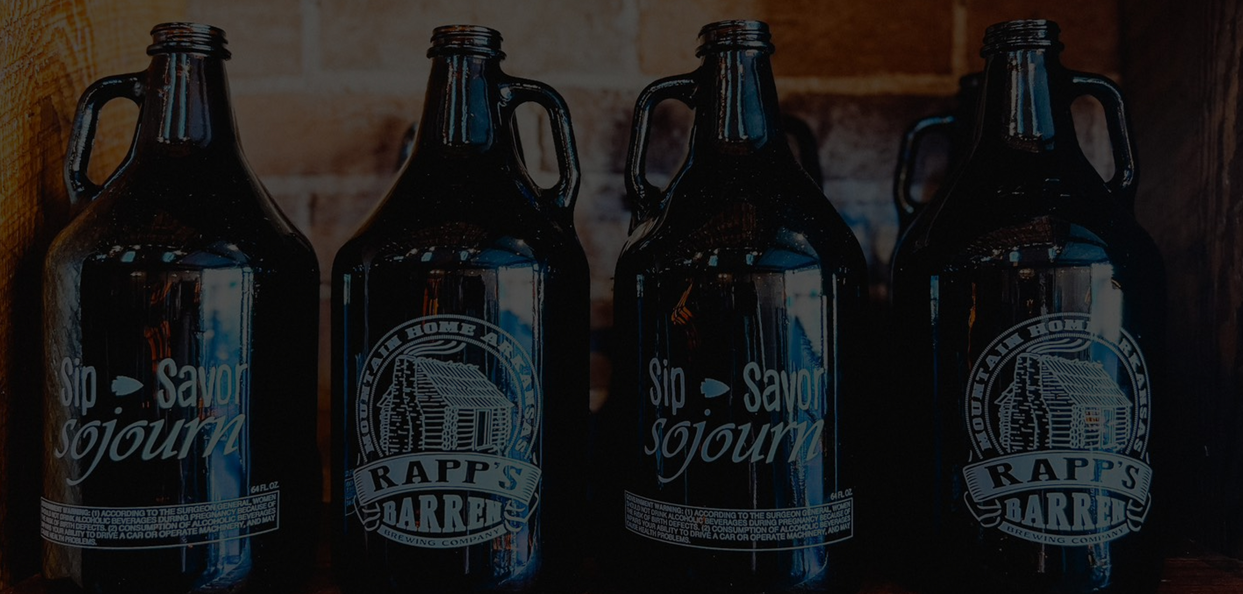 Growlers for beer at Rapp's Barren Brewing company in Mountain Home Arkansas offers, darkened for the website header page